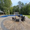 Sunburst Reclaimed Timber Concrete pool with patio chairs