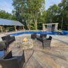 Sunburst Reclaimed Timber Concrete pool with patio chairs