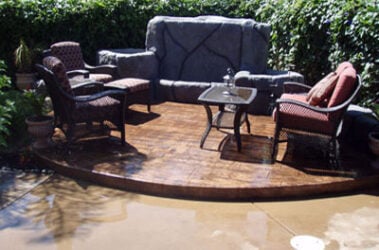 Wood Plank stamped concrete job by Outback Concrete Wood Plank stamped concrete patio with table and chairs