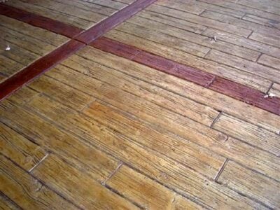 Wood Plank 6" width concrete stamp by Baltz and Sons. The pattern is colored with the rich red accent color to make an impact. Wood Plank concrete stamp by Baltz and Sons