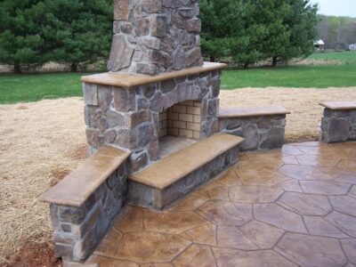 Random Stone Stamped Concrete Patio And Fireplace