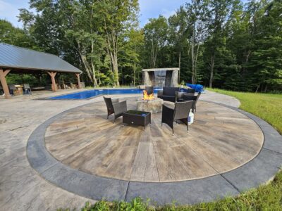 Sunburst Reclaimed Timber Concrete pool with patio chairs