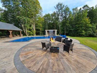Sunburst Reclaimed Timber Concrete pool with patio chairs