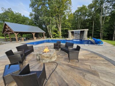 Sunburst Reclaimed Timber Concrete pool with patio chairs